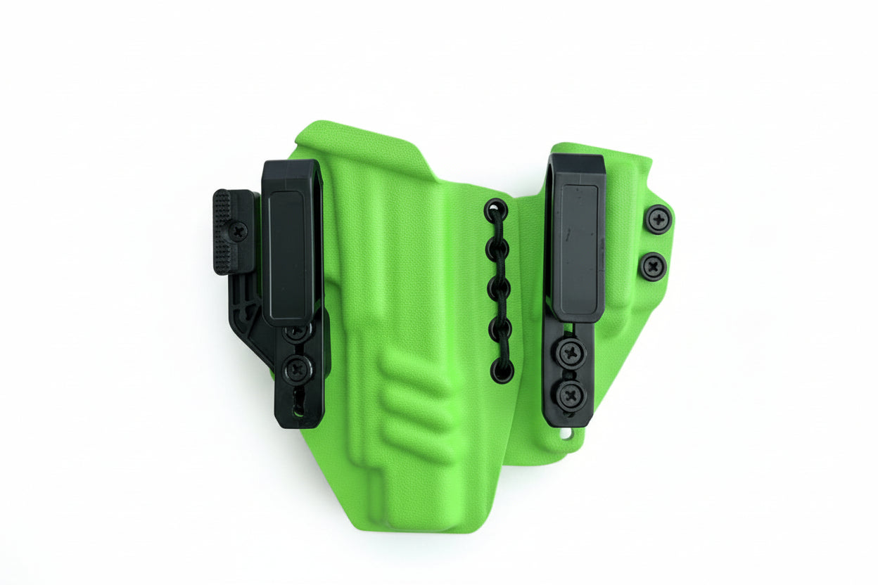 Green holster with black clips on a white background